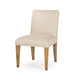 Beige upholstered dining chair with solid wood legs, suitable for a neutral and inviting dining room decor, angle view.