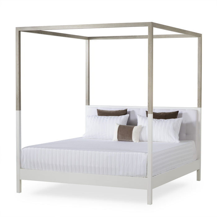 UK King size four-poster bed with a sleek, modern design, featuring a wooden frame in natural hues, offering a contemporary and comfortable addition to any bedroom, Angle View.