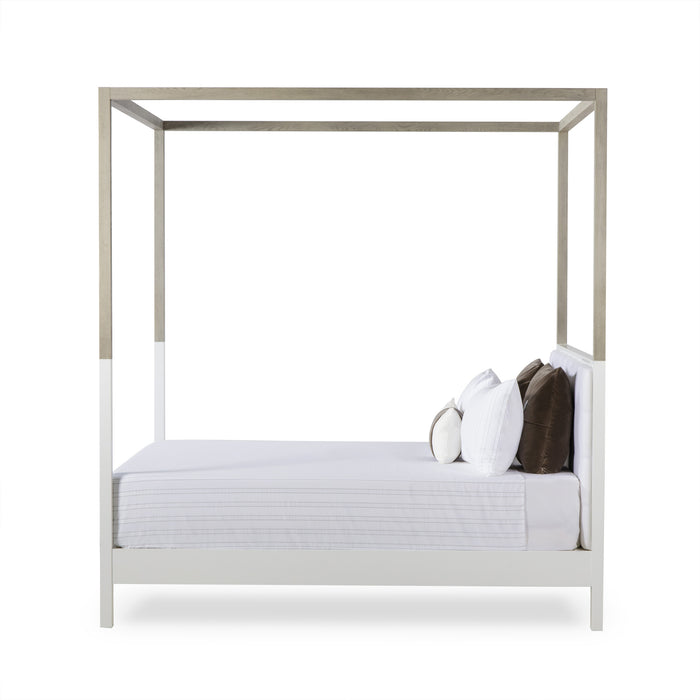 UK King size four-poster bed with a sleek, modern design, featuring a wooden frame in natural hues, offering a contemporary and comfortable addition to any bedroom, Side View.