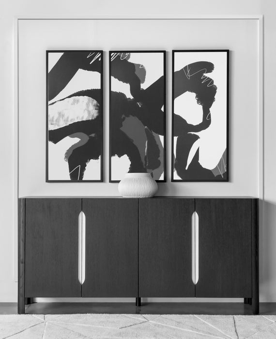 Sleek black sideboard with metallic handles, ideal for contemporary dining room storage and decor, placed in a living room.