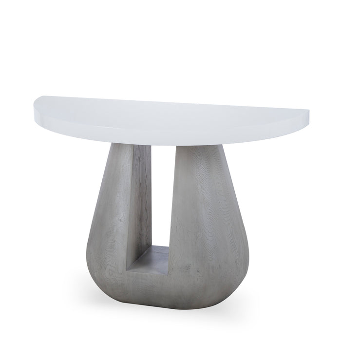 Contemporary round white tabletop dining table with a unique, sculptural grey base, perfect for modern minimalistic interiors.