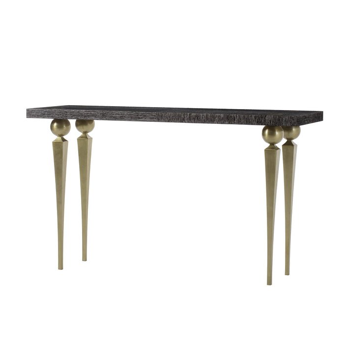 Elegant narrow console table with a textured top and distinctive gold spherical and tapered legs, perfect for luxury interiors.