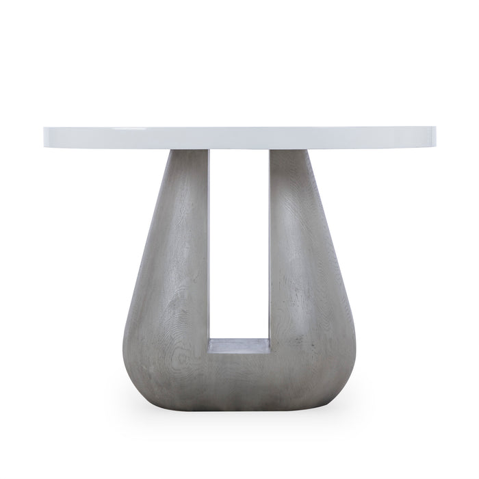 Modern minimalist white round table with a unique concrete pedestal base, suitable for contemporary dining or living rooms.